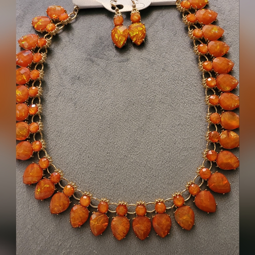 Iridescent orange opalescent necklace and earring set. New with Tags